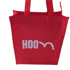 Red tote bag back view with white HOOM logo screen print