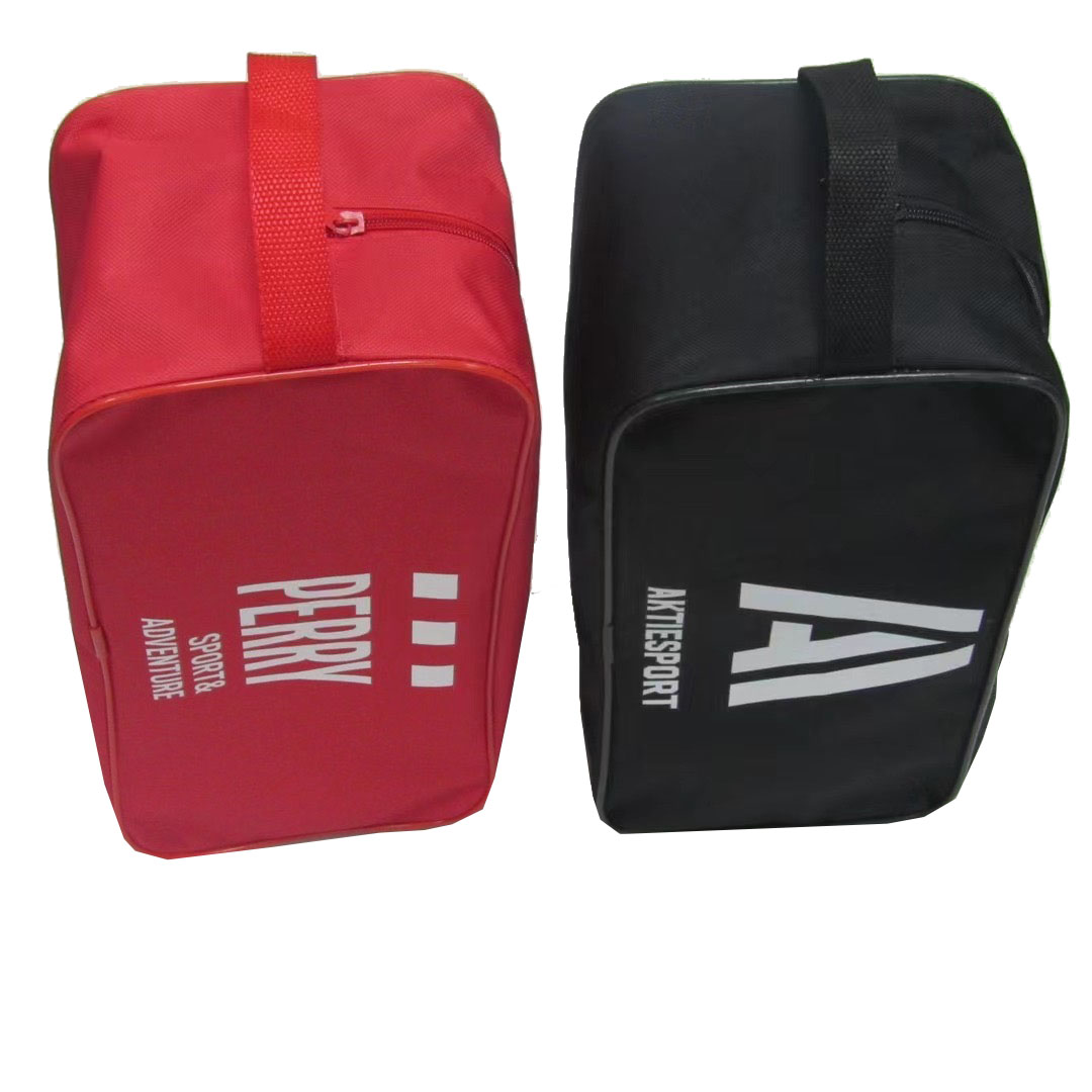 Side view of red and black oxford storage bags showing sturdy woven side handle