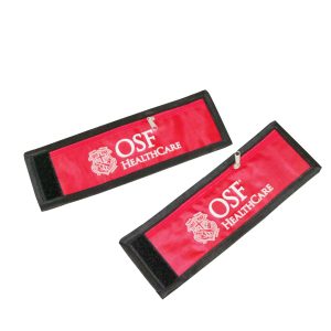 Two red sport wrist wallets with black edge binding and Velcro closure