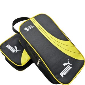 Stack of black and yellow custom sports shoe bags with silk-screen logos