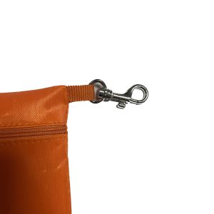 Close-up of silver metal swivel snap hook and webbing attachment on orange pouch