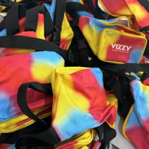 Bulk rainbow tie-dye waist bags with Vizzy Hard Seltzer logo and black straps