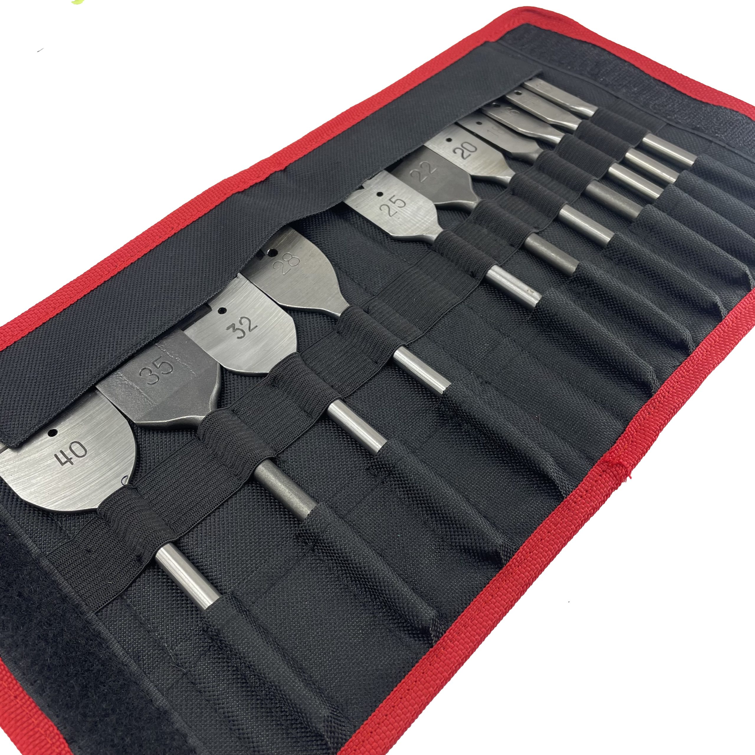 Close-up of elastic webbing slots securing spade drill bits in tool pouch