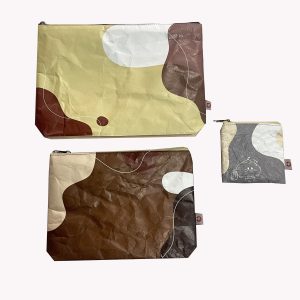 Set of Tyvek coin pouches in various sizes with abstract color block patterns
