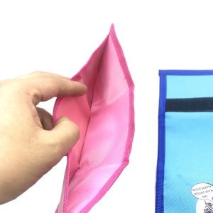 Hand holding open pink wallet showing spacious bill compartment
