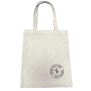 White canvas tote bag with black circular city guide logo print