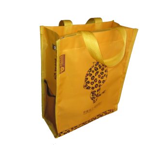 Yellow kids bag side view showing side mesh pocket and sturdy handle